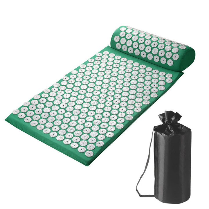 Green acupressure mat with white floral patterns and carrying bag on a white background